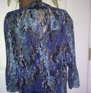 Blouse in shades of blue.